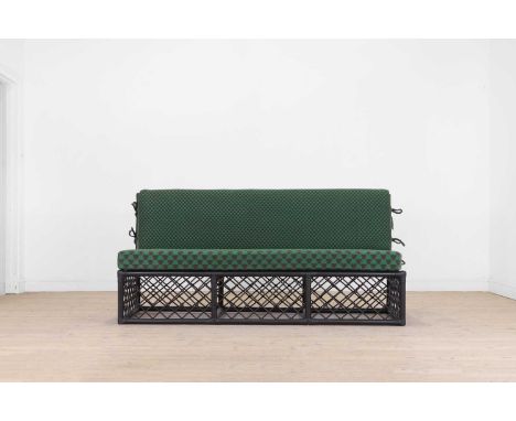 An ebonised rattan ‘Hurlingham’ three-seater sofa by Soane, of recent manufacture, with two squab cushions, 181cm wide76cm de