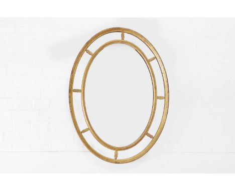 A George III gilt-gesso wall mirror, late 18th/early 19th century, the later oval plate within a segmented twin moulded frame