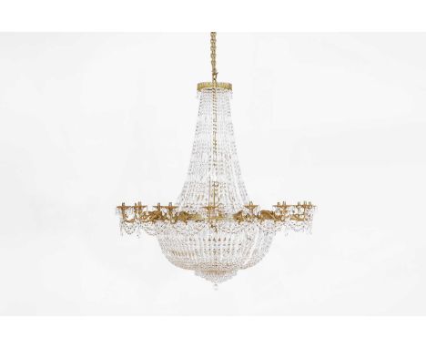 A George III-style cut-glass and brass chandelier, 20th century, of tent and bag form, with a pierced circular apron suspendi