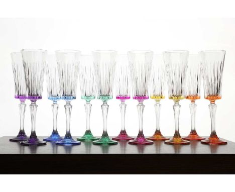 A set of twelve crystal glass champagne flutes, of recent manufacture, French, Baccarat, each with a coloured bowl and foot, 