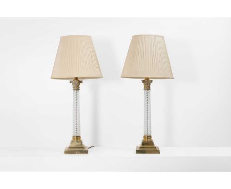 A pair of glass and gilt-metal table lamps, 20th century, each of classical form, with a Corinthian capital over a twisted gl