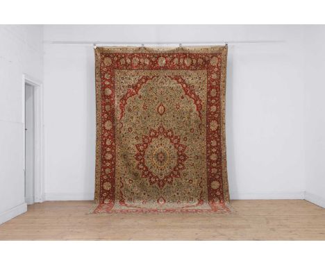 A Hereke silk rug, 20th century, Anatolian, the rectangular field with a pendant medallion to the centre surrounded by floral