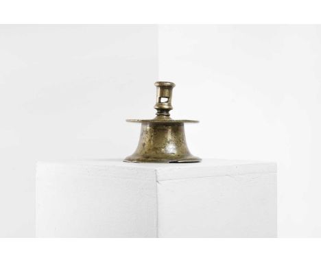 A bronze capstan candlestick, last quarter of the 16th century, Spanish, the tall socket with a rectangular extraction hole, 