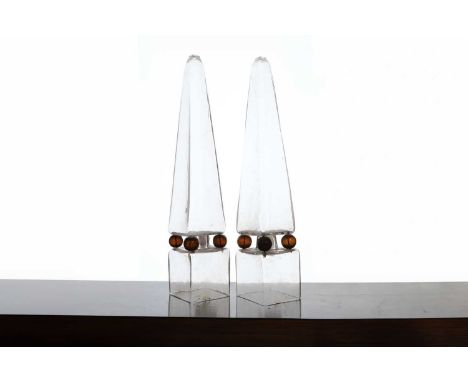 A pair of glass obelisks, late 19th/early 20th century, Italian, Venice, each raised on four amber-coloured ball feet and a p