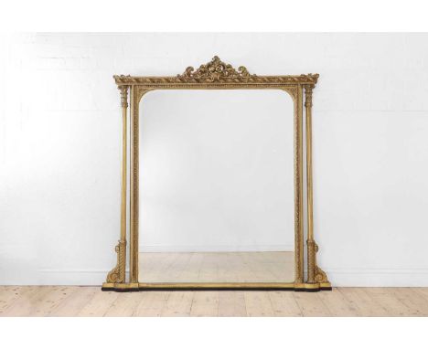 A Victorian carved giltwood and gesso overmantel mirror, mid-19th century, the frame decorated in the rococo taste, bearing a