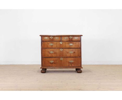 A walnut chest of drawers, early 18th century and later, fitted with two short above three long drawers, on bun feet, 104cm w