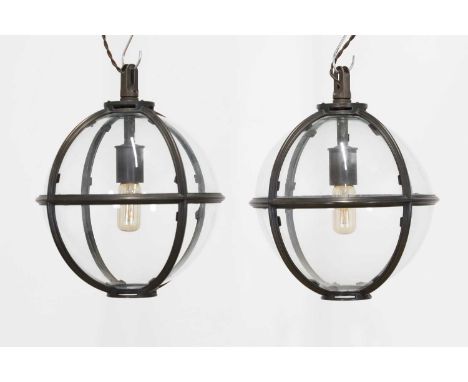 A pair of bronze and glass 'Mott' globe lanterns by Jamb London, of recent manufacture, each with a single light and hanging 