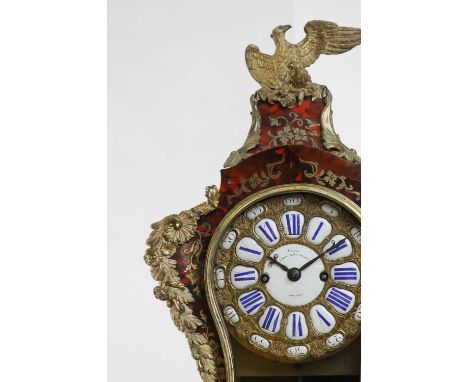 A Louis XV-style gilt-bronze and tortoiseshell bracket clock, the sectional enamelled dial with Roman and Arabic numerals, an