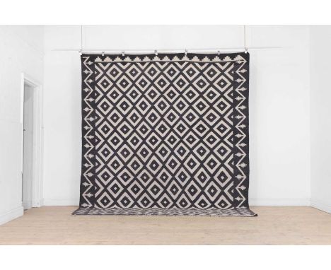 A flat-weave wool carpet of Azilal design, of recent manufacture, the central field decorated with repeating geometric motifs