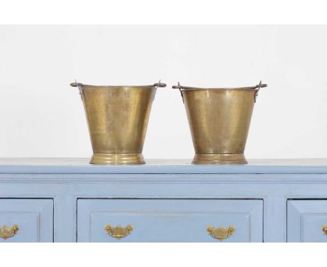 Two brass buckets, 19th century, each with a loop handle and flared foot,32cm diameter 40cm high including handle (2)Conditio