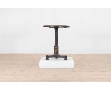 A black and gilt japanned occasional table, 19th century, the circular scagliola top with chequerboard decoration, raised on 