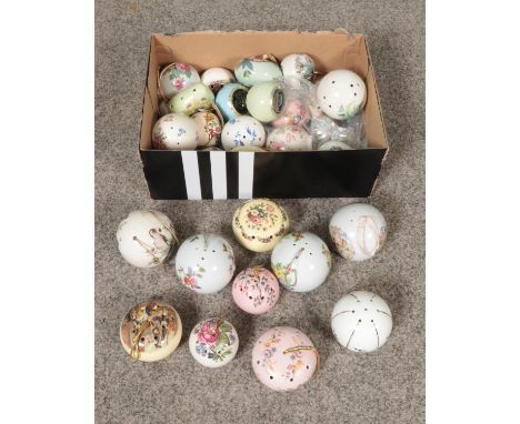 A collection of ceramic pomander fragrance infusers.