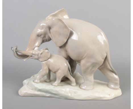 A Lladro ceramic figure of an Elephant with calf, printed mark to underside. Approx. height 18.5cm.