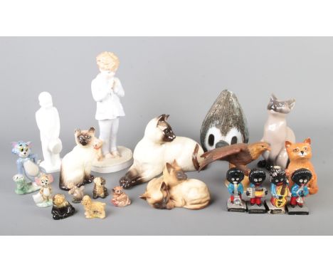 A collection of assorted ceramic figures to include Bing & Grondahl Siamese cat, Royal Doulton NSPCC I Pray, Beswick Siamese 