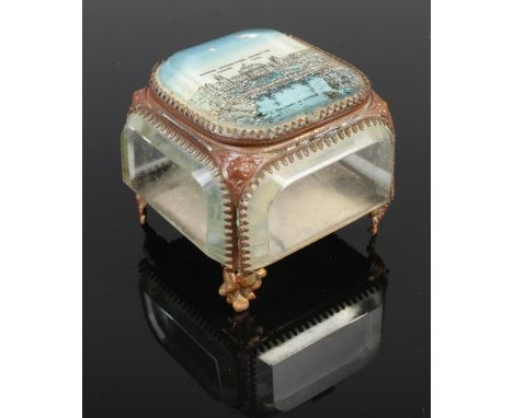 A bevelled edge glass ormulu trinket jewellery box, the top panel bearing plaque for 'The Imperial International Exhibition, 