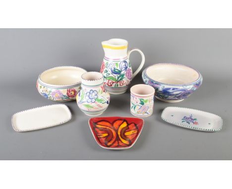 A quantity of Poole Pottery including jug, vase, bowls, dishes etc