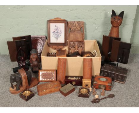 A large collection of treen and wooden items including trinket boxes, music boxes, carved figure of a cat, carved monkey, wal