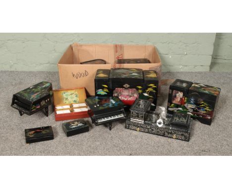 A collection of oriental style boxes including music boxes, trinket boxes, jewellery boxes with piano shaped examples and sev