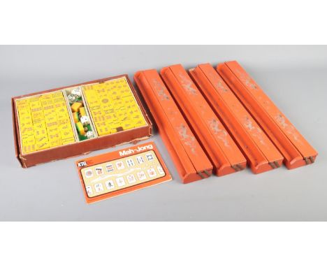 A cased Mah-Jong set with four orange lacquered Mah-Jong tile holders with gold painted dragons