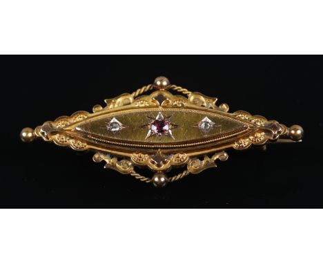 A late Nineteenth Century 15ct Gold ruby and diamond three stone brooch with decorative rope twist border. Assayed Birmingham
