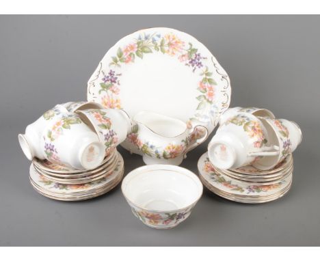 A Paragon part tea service in the Country Lane pattern to include milk jug, sugar bowl, tea cups and saucers. Approx. 26 piec