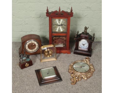 A box of assorted, mostly quartz, clocks to include Highlands 31 Day pendulum wall clock, oak cased mantle clock and Smith gi