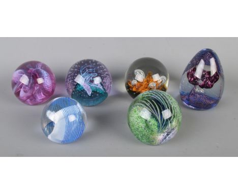 Six Caithness glass paperweights. Includes Trapeze, Cinnabar, Aries, Fiesta, Moonflower and Cauldron.