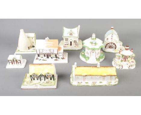 A collection of nine ceramic Coalport Cottages