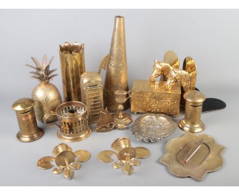 A collection of brassware to include trench art Army Ordnance Corps vase, telephone box, candlestick, pineapple jar, horse he