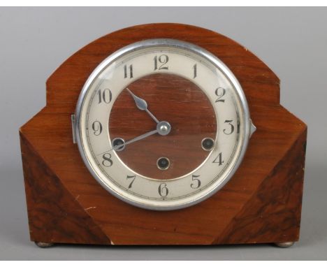 A mahogany and walnut Westminster chime mantel clock with Haller movement.