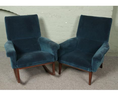 A vintage green velvet upholstered and teak three piece suite, possibly Scandinavian. Includes two seater sofa, rocking chair