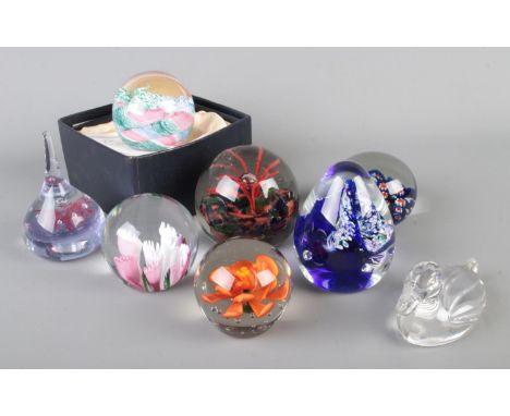 A collection of assorted art glass paperweights to include boxed Caithness Cauldron designed by Innes Burns, Caithness Deja V
