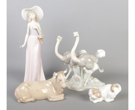 Four Nao by Lladro ceramic figures to include Ostrich figure group, girl with flower basket, dog and recumbent cow.