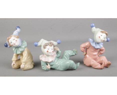 Three Nao by Lladro baby clown figures.