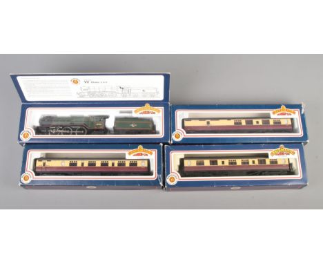 Four boxed Bachmann 00 gauge Branch Line train models. Includes Gresley V2 Class 2-6-2 locomotive and three passenger carriag