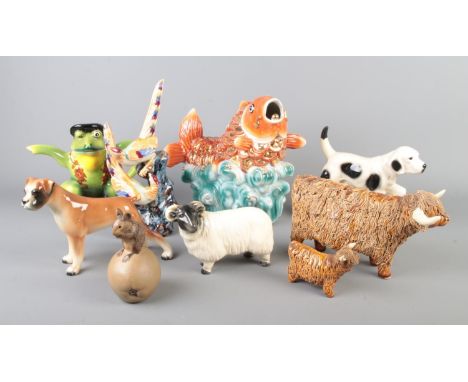 A collection of ceramic animals including large koi fish, novelty frog teapot, dog, ram, boxer dog, Poole mouse etc