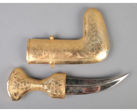 A middle eastern Jambiya dagger featuring heavily decorated gold coloured scabbard and hilt.CANNOT POST