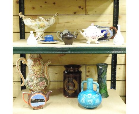 A shelf of pottery, to include a Brannam pottery vase and a stoneware jar, 26cm