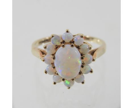 A 9 carat gold opal cluster ring, boxed, size L