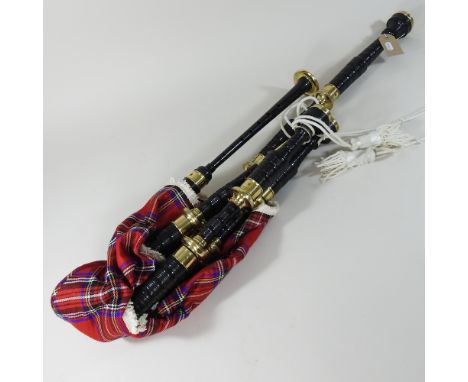 A modern set of bagpipes, together a collection of musical instruments, to include violins, a clarinet, cased and an accordio