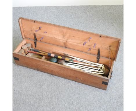 A vintage wooden croquet set, in a wooden case, 105cm