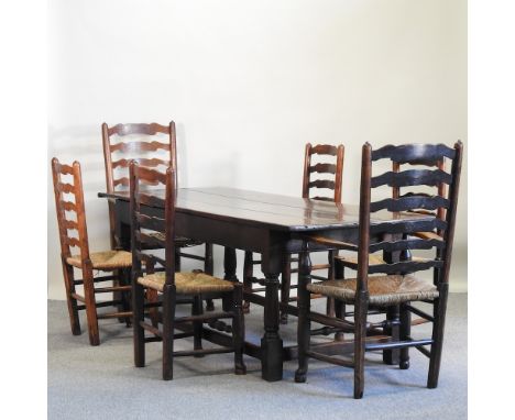 A 19th century style oak refectory table, 220 x 80cm, together with a near set of six rush seated ladder back dining chairs, 