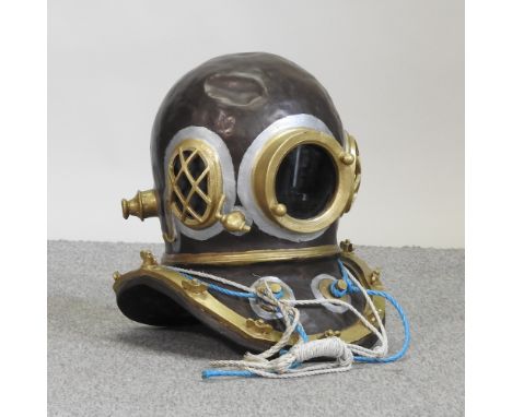 A life size model of a diver's helmet, 42cm high, together with a leather Gladstone bag