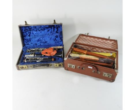 A clarinet, cased, together with various wooden recorders