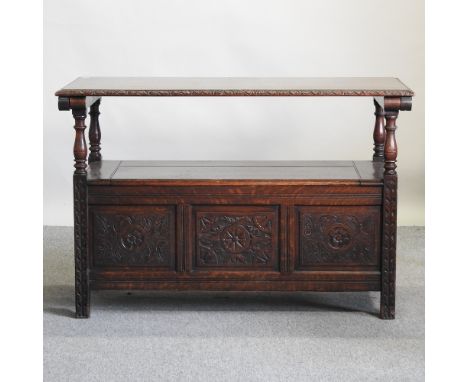 An early 20th century carved oak monk's bench, 120cm