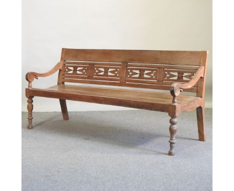 A fruit wood bench, with a carved back, on turned legs, 190cm