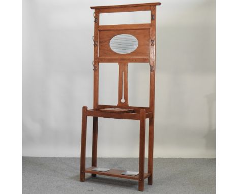 An early 20th century light oak hallstand, with an inset mirror, 81cm