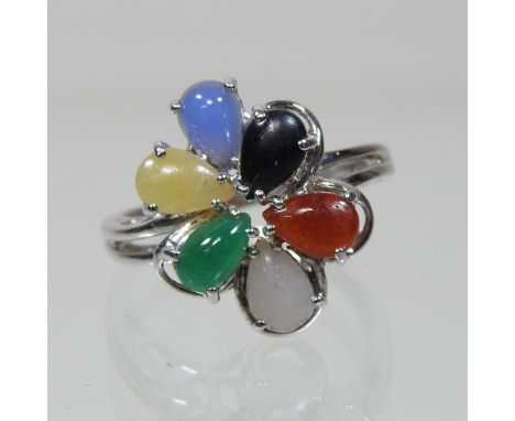 An 18 carat white gold and coloured jade ring, boxed, size M