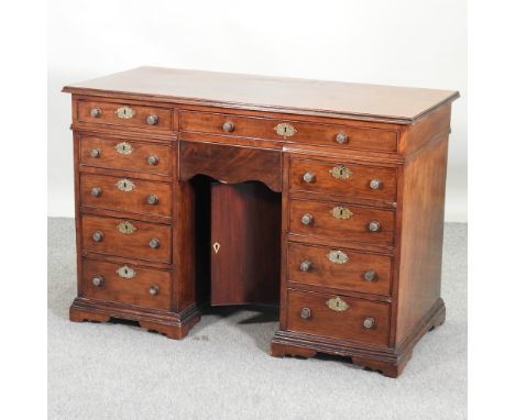 A 19th century mahogany kneehole desk, on bracket feet, 116cm