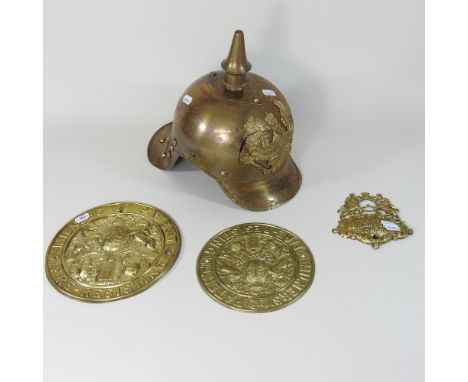 A German style helmet, together with a collection plaques, a fire extinguisher, and a collection of walking sticks 
